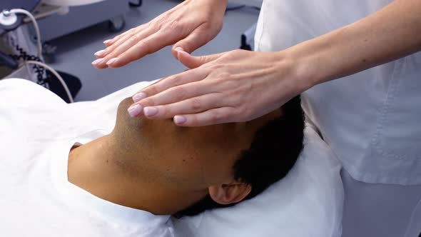 Male patient receiving massage from doctor alt
