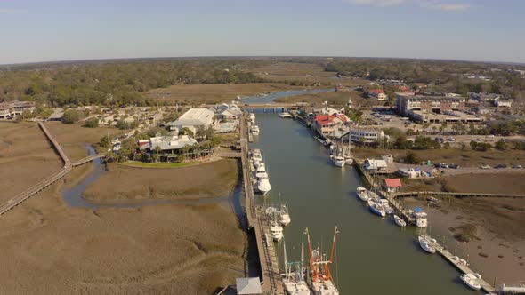 Boats line the waterway at Shem Creek alt