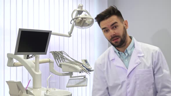 Dentist Poses at the Office