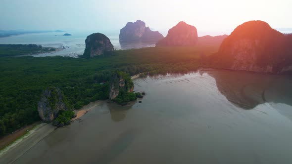 Aerial sunset above mountain silhouette. Beautiful views of the Andaman Sea alt