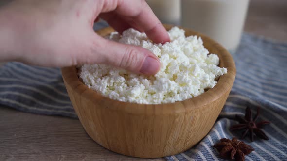 Traditional homemade cottage cheese in a wooden bowl Healthy and fermented food alt