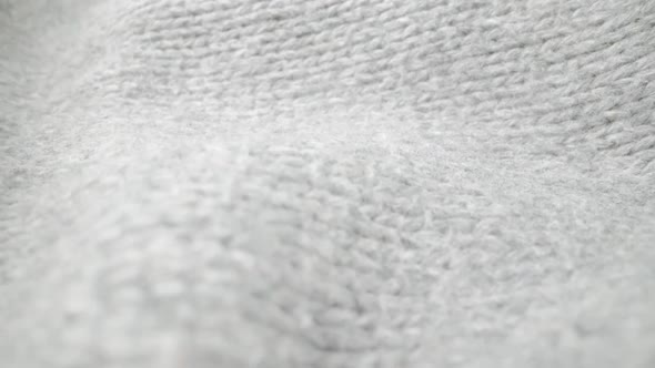Extreme Detail View of Sheep Wool Cloth Texture Flowing in Macro Dolly Shot alt
