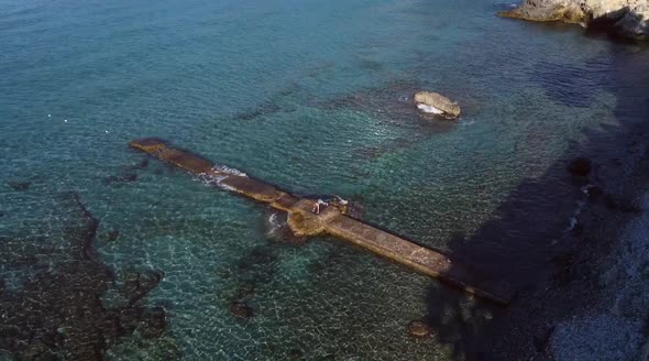 Flexible woman doing yoga in High Cobra pose alt