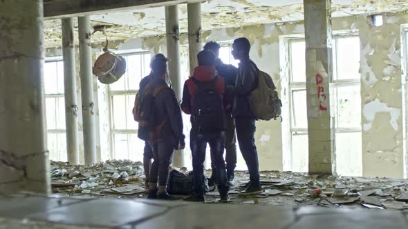 Arab Men Talking in Abandoned Building alt