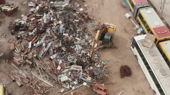 Metal Scrap Waste Pile at Recycle Center With Bulldozer Sorting Used Auto Parts alt