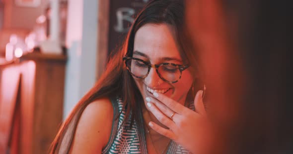 Woman reading the menu and smiling alt