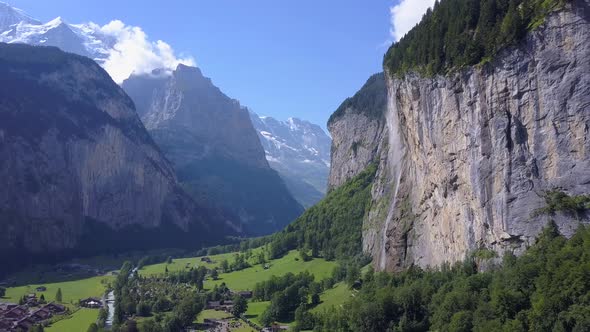 Aerial travel drone view of the Lauterbrunnen Valley and Staubbach Falls, Switzerland. alt