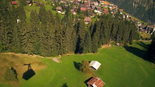 Tracking shot of a town in Switzerland taken from a descending tram alt