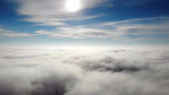 Camera Is Raising Above From The Thick Fog Above The Beautiful Clouds