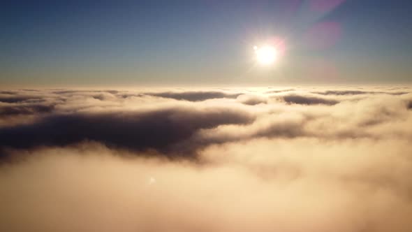 Airplane view in the sky, white fluffy clouds up in the sky, floating slowly