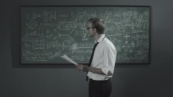 Disappointed mathematician erasing his work on the chalkboard