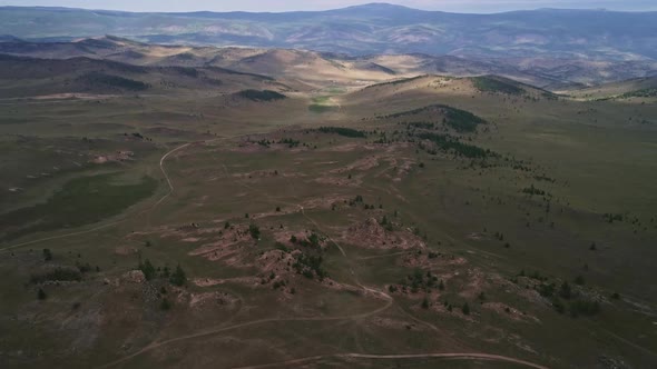 Baikal Valley spirits,Tazheran Steppe, Stone Cliffs on the Road. Aerial Summer alt