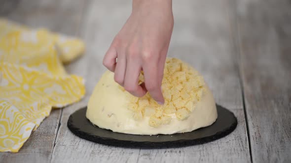 Woman Makes Traditional Mimosa Cake with Pineapple