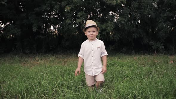 Happy Young Boy Runs To the Camera and Rejoices