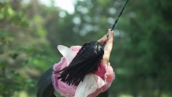 Girl in fairy princess costume on tire swing, shot on Phantom Flex 4K alt