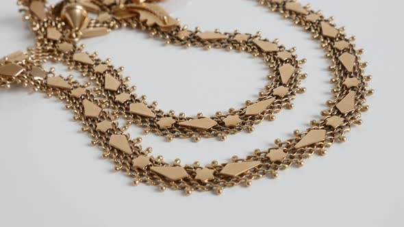 Panning on luxurious golden necklace chain 4K video alt