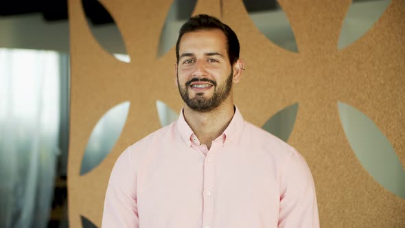 Portrait of Handsome Guy Who Genuinely Smiling alt