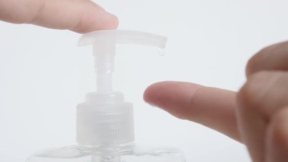 Slow motion sanitizer gel  extraction from plastic  bottle close-up video alt