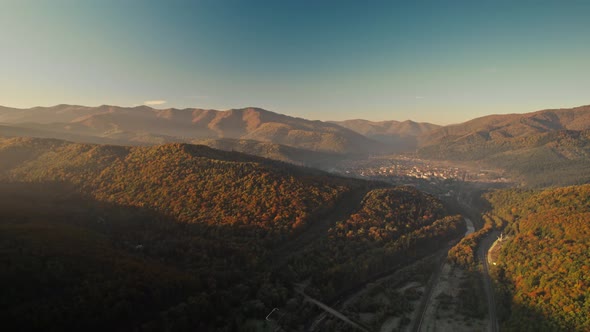 Aerial Drone Flight Over Landscape in Mountain Valley with Ukrainian Village in Carpathians Western alt