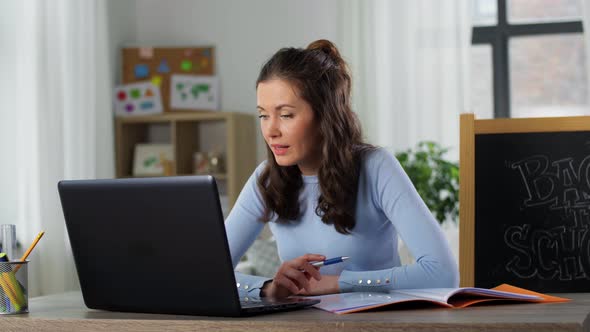 Teacher with Laptop Having Online Class at Home alt