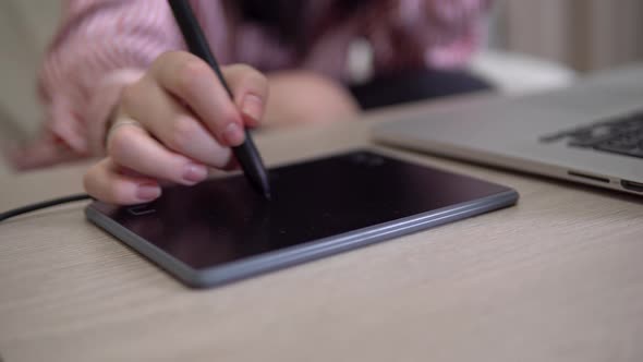 Disigner Woman Freelancer Using Pen with Digital Tablet Computer Drawing Working