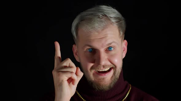Thinking Man Looking Around Thinks Scratches at Temple Comes Up with Ideas Raised Finger Up alt