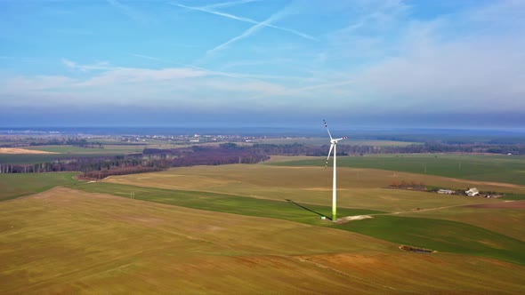 Wind turbine on field, aerial view alt