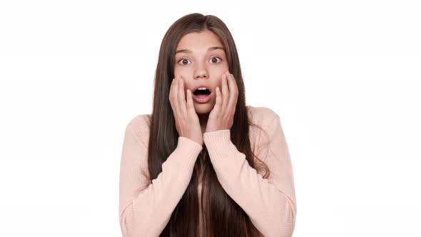 Closeup Portrait of Young Scared Woman 20s Expressing Fright with Open Mouth Being Shocked Hearing alt