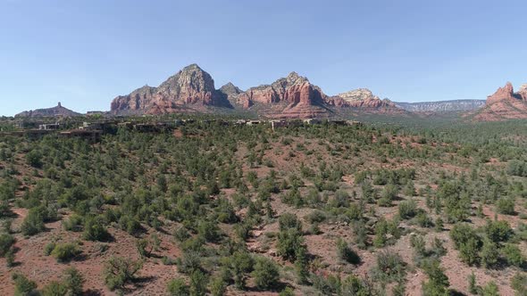 Aerial of Sedona valley and butte formations alt