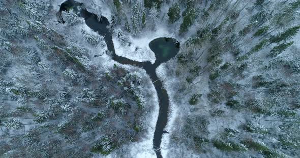 Holy Sacred Spring Water Lake and River in Winter Forest Aerial View alt