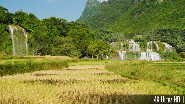 4K Ban Gioc Waterfall in Rural Landscape with Mountains alt