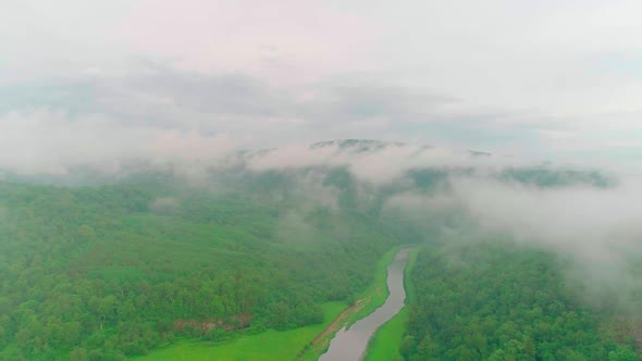 Aerial Video of Clouds Mountains Forest and Mountain River alt