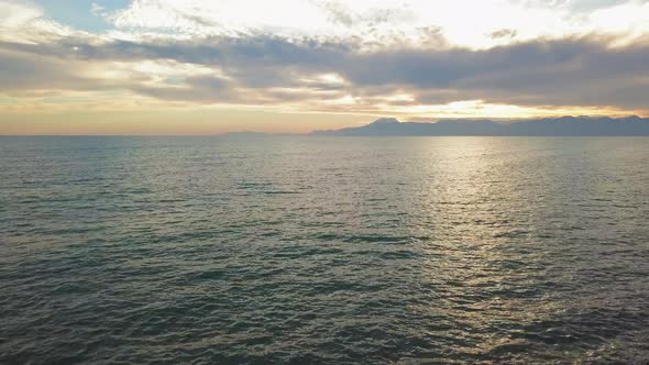 Beautiful Sunset at Beach with Golden Sun Reflection on the Sea