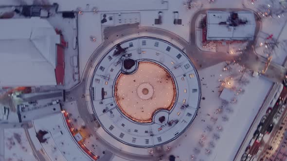 Aerial Drone View of Bottle Building of the New Holland Island in a Snowy Winter Evening Roundabout alt