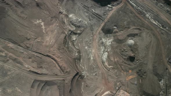 Flight Over a Mining Quarry with Equipment for Coal Mining. Working Bucket Wheel Excavator. alt