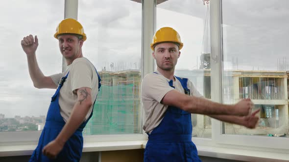 Construction Workers Dancing in Helmets alt