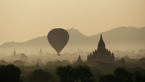 Balloon flying during sunrise over the Pagodas  alt