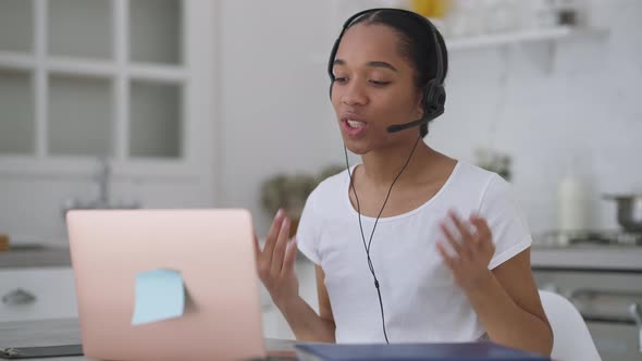 Young Confident African American Woman Explaining Startup Strategy in Video Chat on Laptop alt