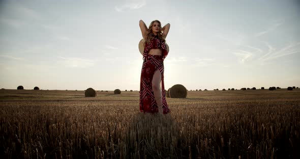 Young Girl In A Field In A Straw Hat alt
