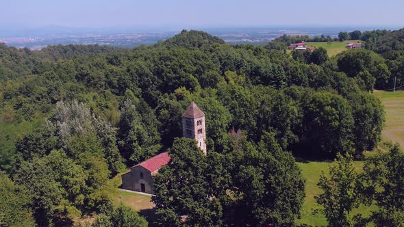 Above View of Isolated Old Catholic Christian Romanesque Church with Bell Tower in Nature Outdoor
