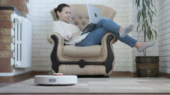 Robot vacuum cleaner at work. alt