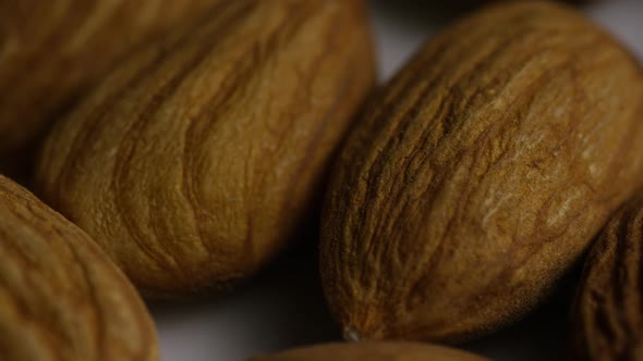 Cinematic, rotating shot of almonds on a white surface - ALMONDS 010 alt