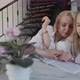 Girl Doing Homework with Mothers Help - VideoHive Item for Sale