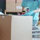 Closeup of Cardboard Box with Food Packed By Volunteer in Charity Company - VideoHive Item for Sale