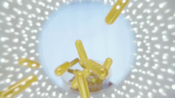 Yellow Capsules Of The Medication Is Falling Down Into The Camera