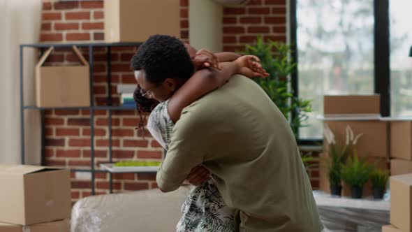 Husband and Wife Hugging Each Other and Celebrating Life Event alt