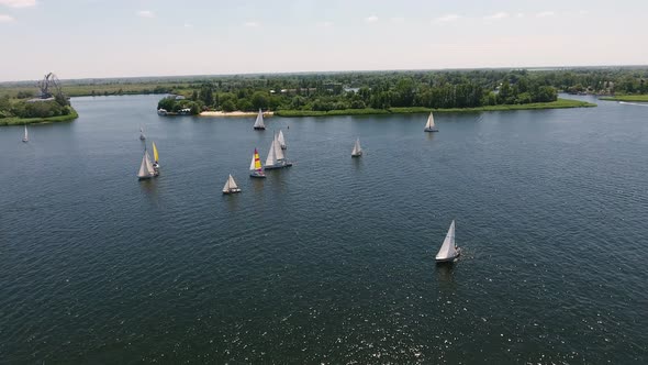 Aerial Shot of White Yachts Competing in the Dnipro River on a Sunny Day  