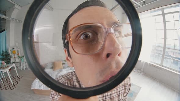 Nerd Looks Through Magnifier Glass alt