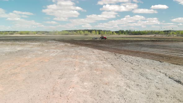 The Farmer Prepares the Ground for Sowing the Future Crop. Modern Agribusiness alt