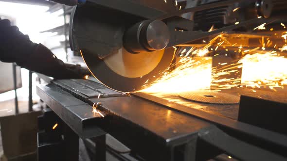 Circular Saw Sawing Steel at Industrial Manufacture alt